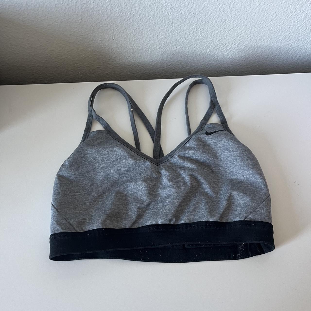 Grey Nike sports bra, no padding inside and is a... Depop