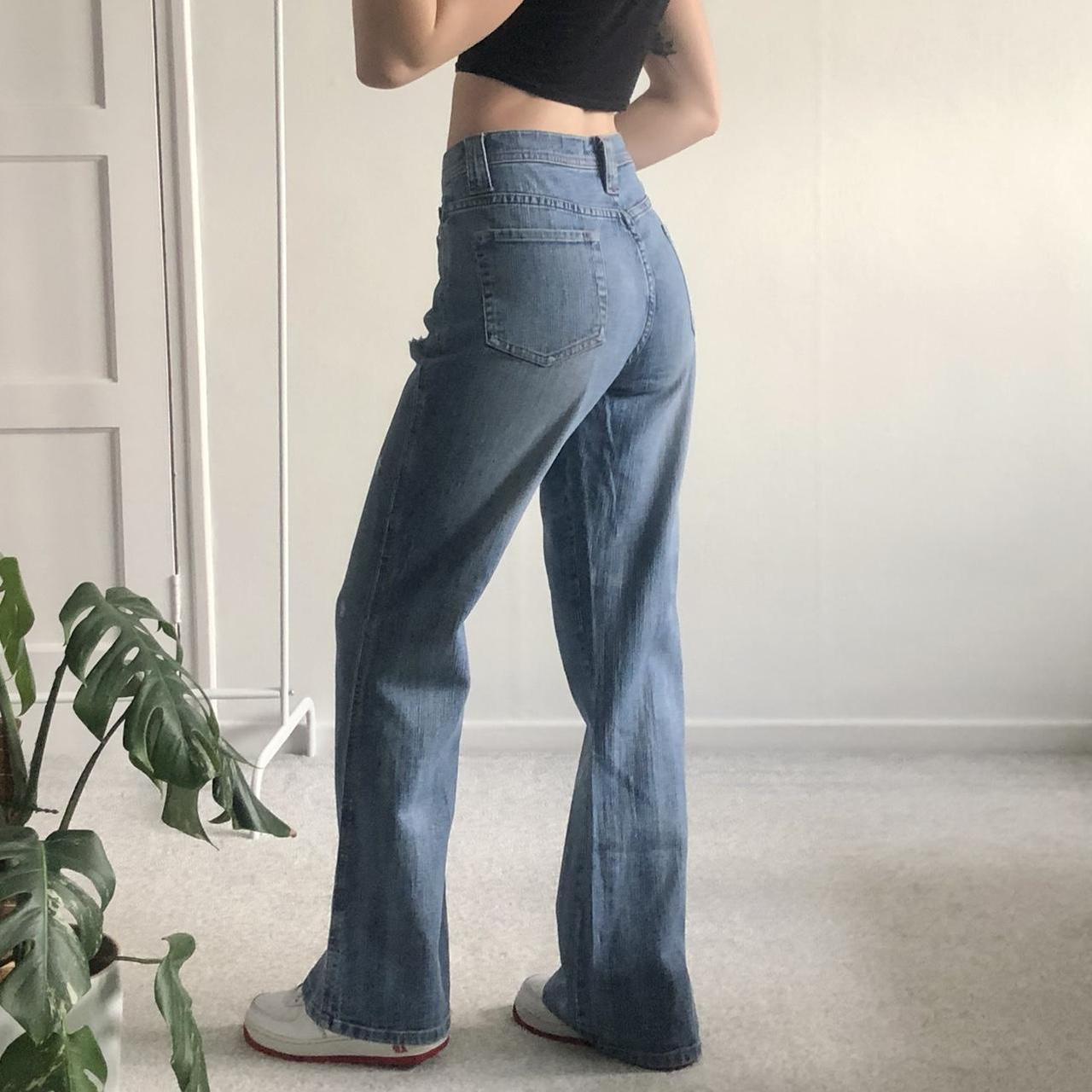 Y2K mid rise distressed flared jeans in a light wash... - Depop