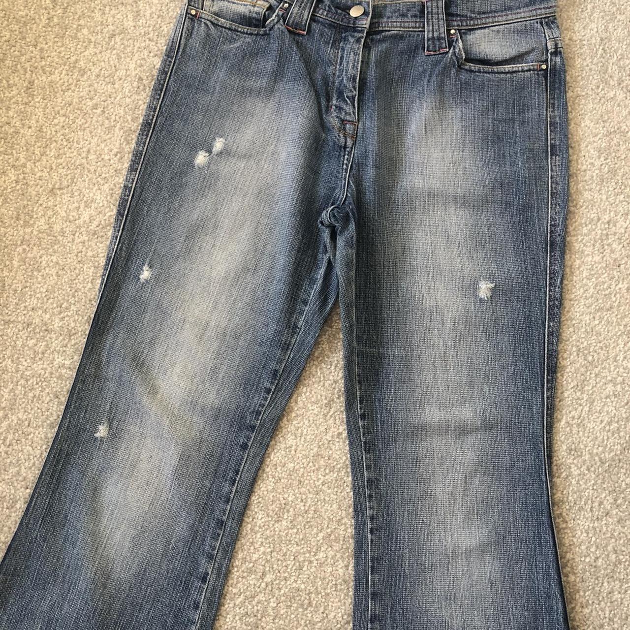 Y2K mid rise distressed flared jeans in a light wash... - Depop