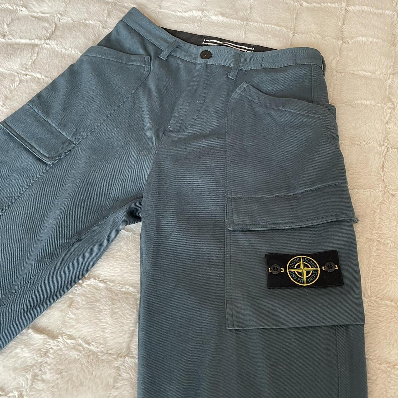 STONE ISLAND. Blue cargo work pants, cargo pocket...