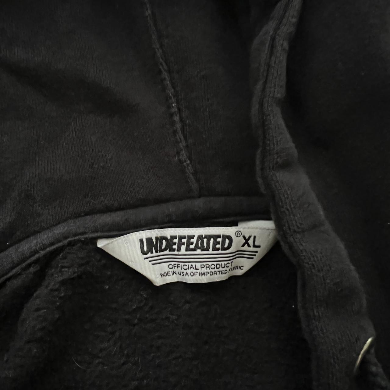 undefeated black zip up hoodie. size xl. but fits a... - Depop