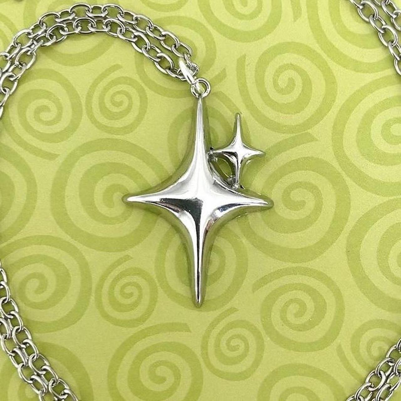 Silver tone puffed star necklace! Love this piece,... - Depop