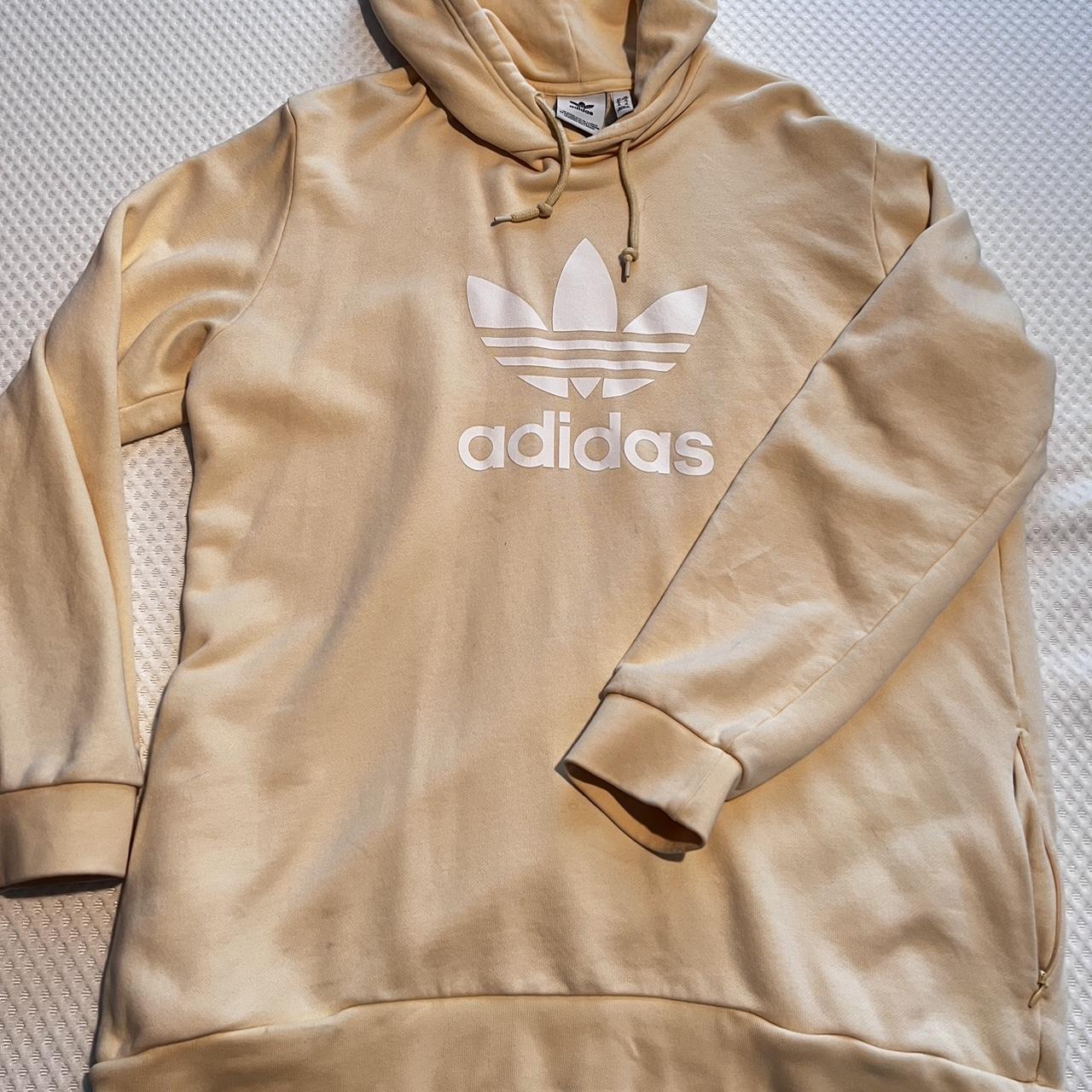 Yellow peach Adidas hoodie with side pockets. 2 dark