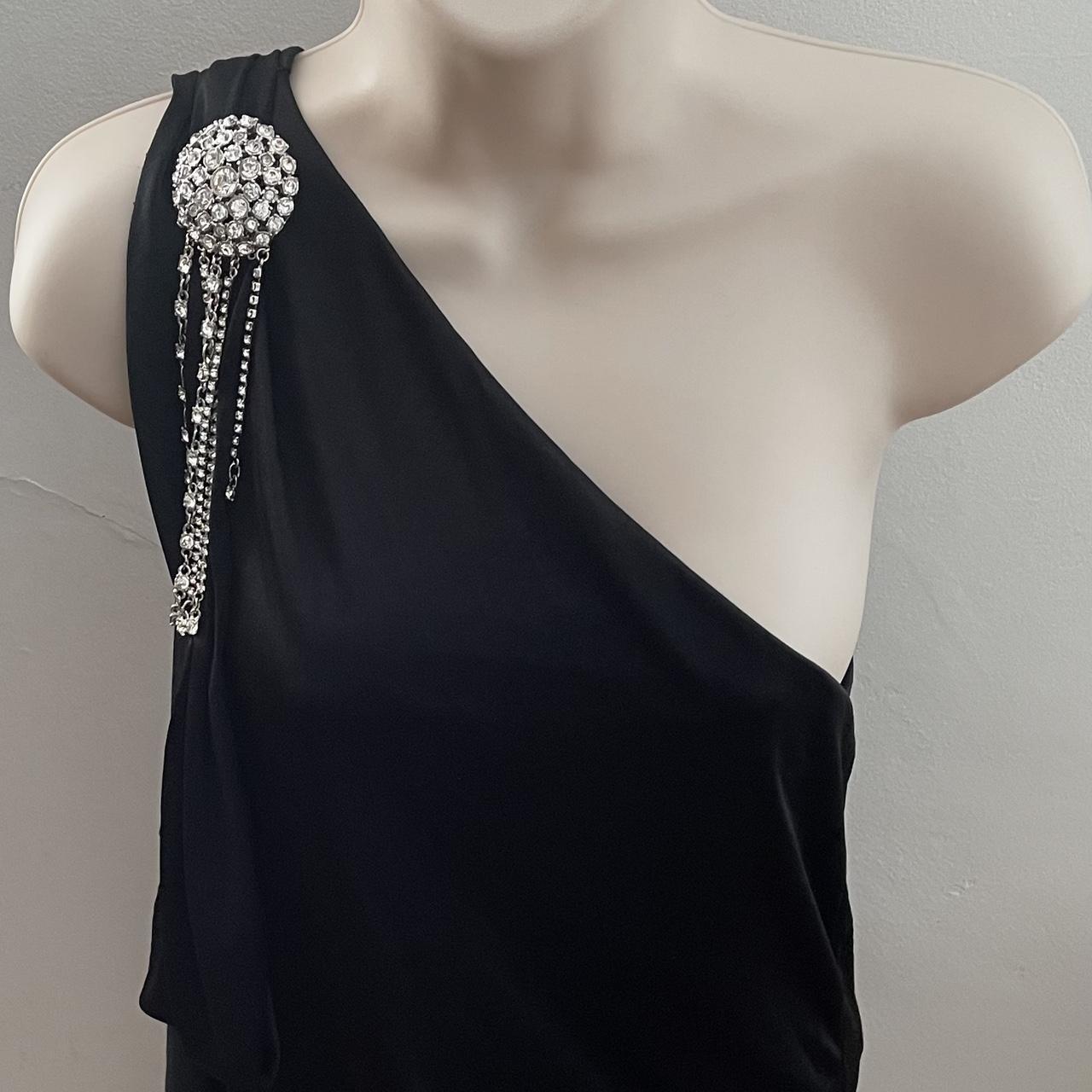 BCBG Maxazria black one shoulder crystal brooch