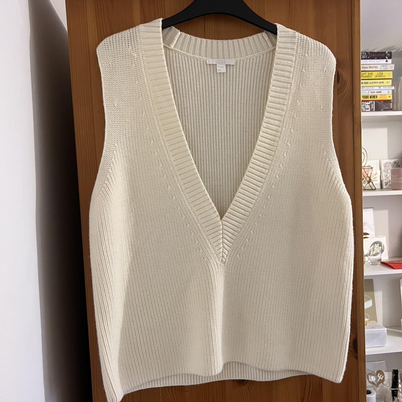 Cream deep v-neck knitted vest by COS. A new take... - Depop
