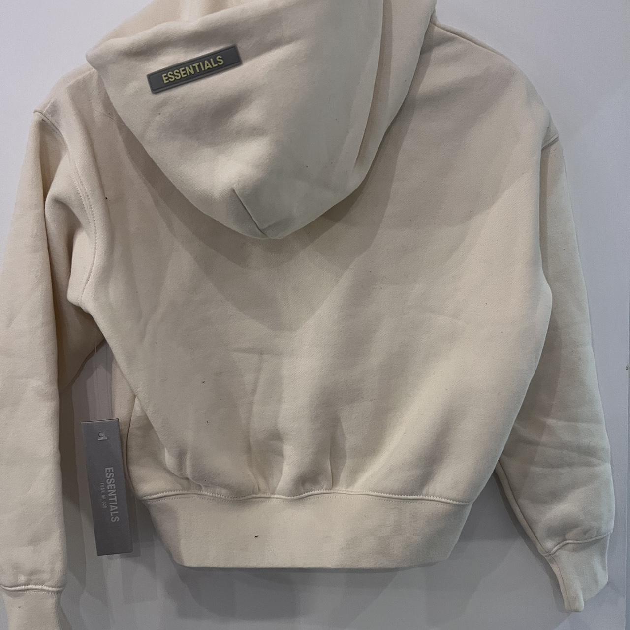 Fear Of God Essentials Kids Hoodie Cream/Buttercream... - Depop