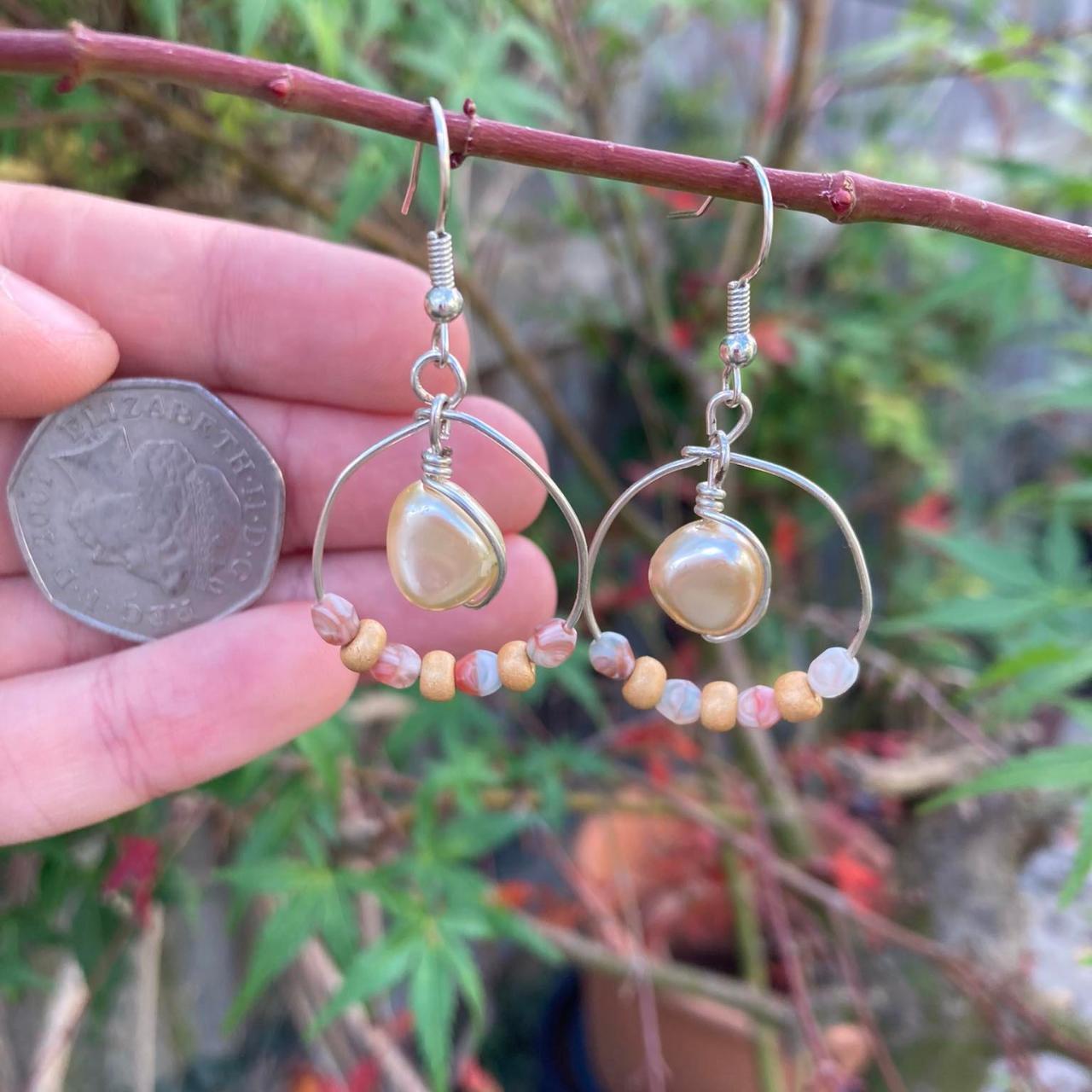 Artisan handmade hanging earrings made with pearls... Depop