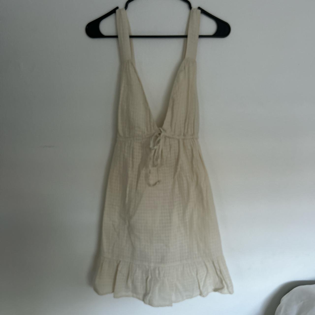 Cream Backless Mini Dress NWT Slightly altered by... - Depop