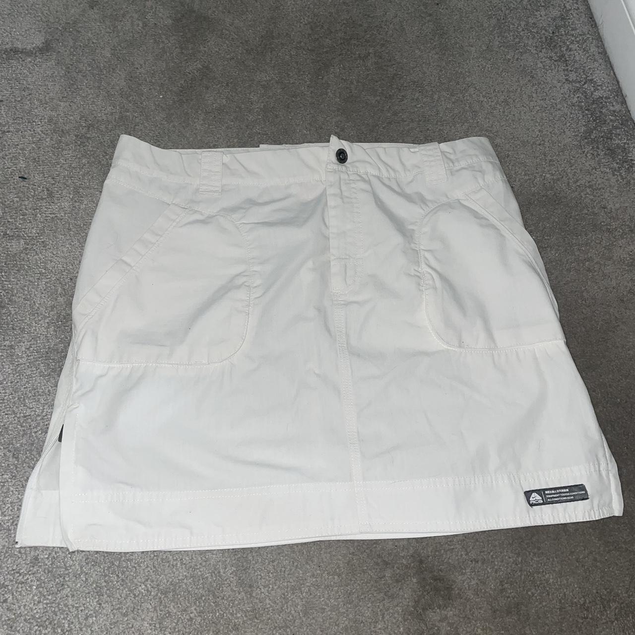 White Nike ACG cargo skirt with pockets and zips on... Depop