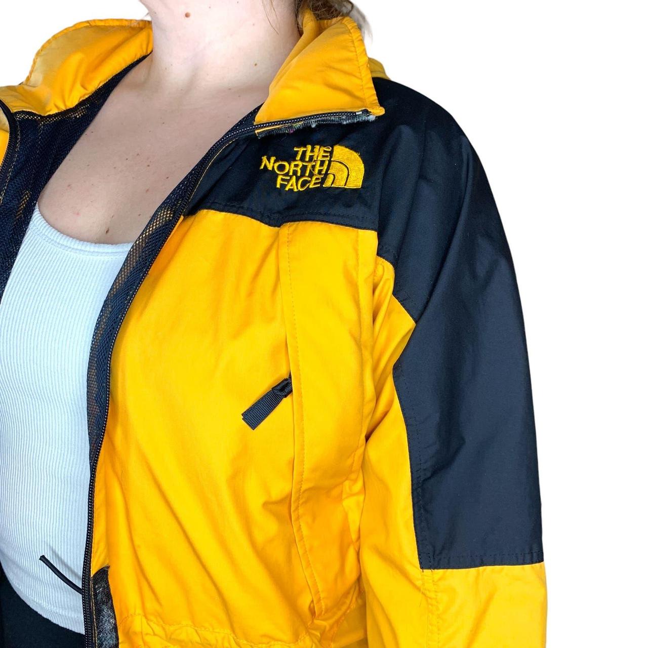 North face women's online yellow and black jacket