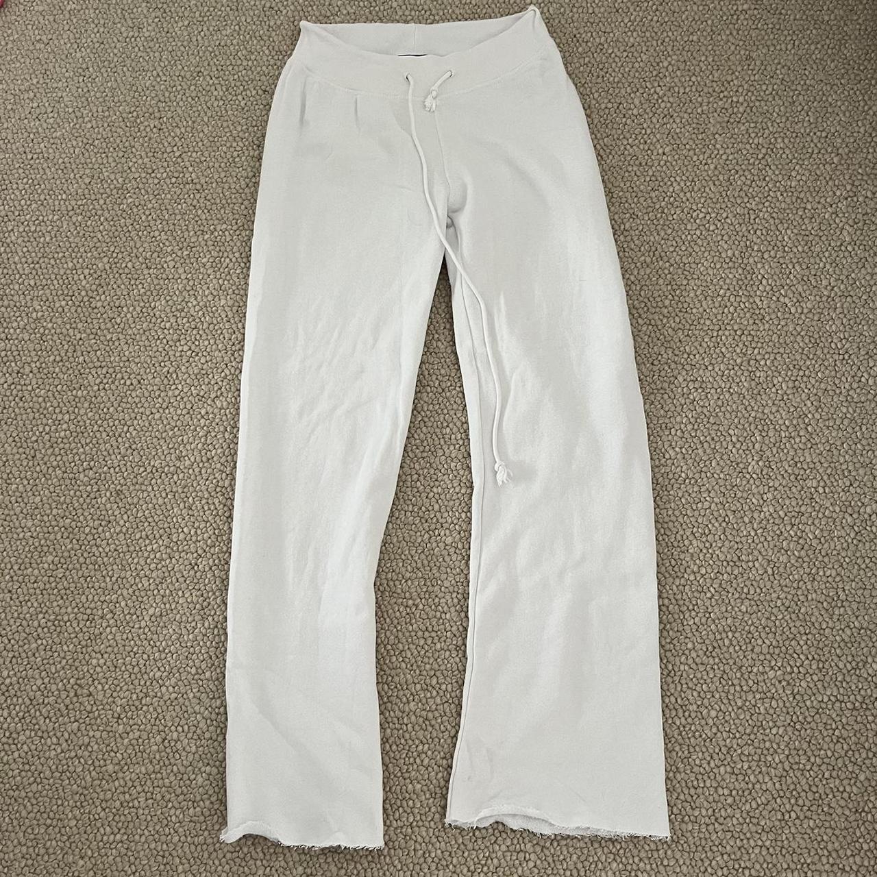 Brandy Melville white low rise flare sweat pants.... Depop