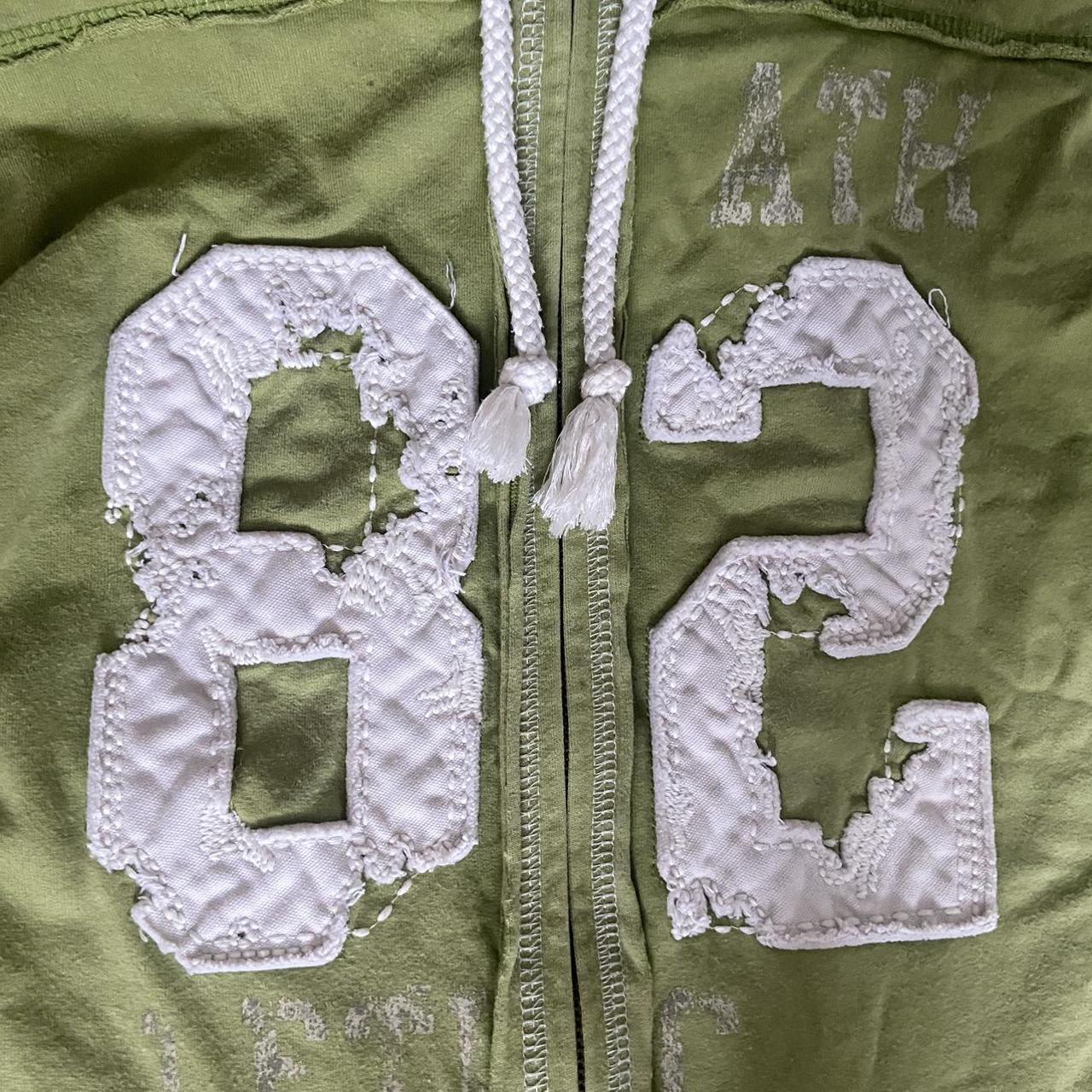 Cute light green zip up hoodie with white stitching - Depop