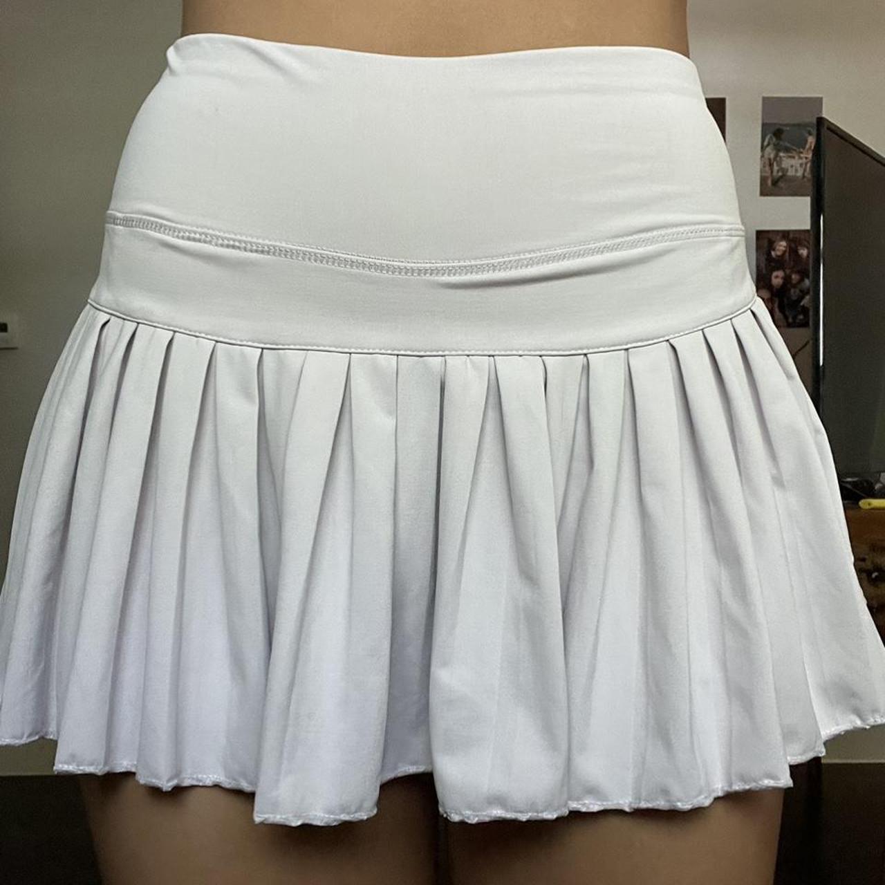 light pink gold hinge skirt branding on the back is... Depop