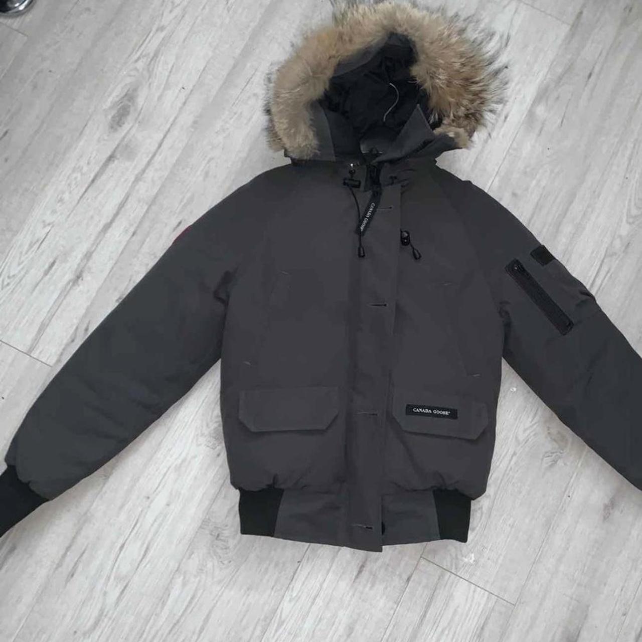 Grey Canada goose bomber jacket few tears on the... - Depop