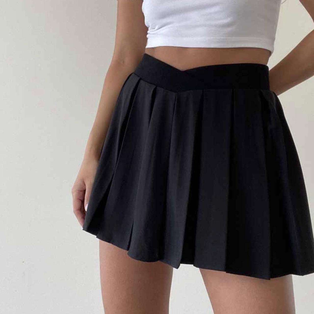Black pleated v cut skirt with built in shorts... - Depop