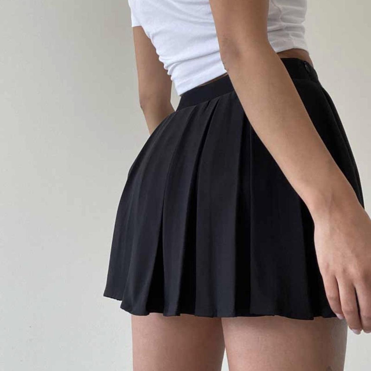 Black pleated v cut skirt with built in shorts... - Depop