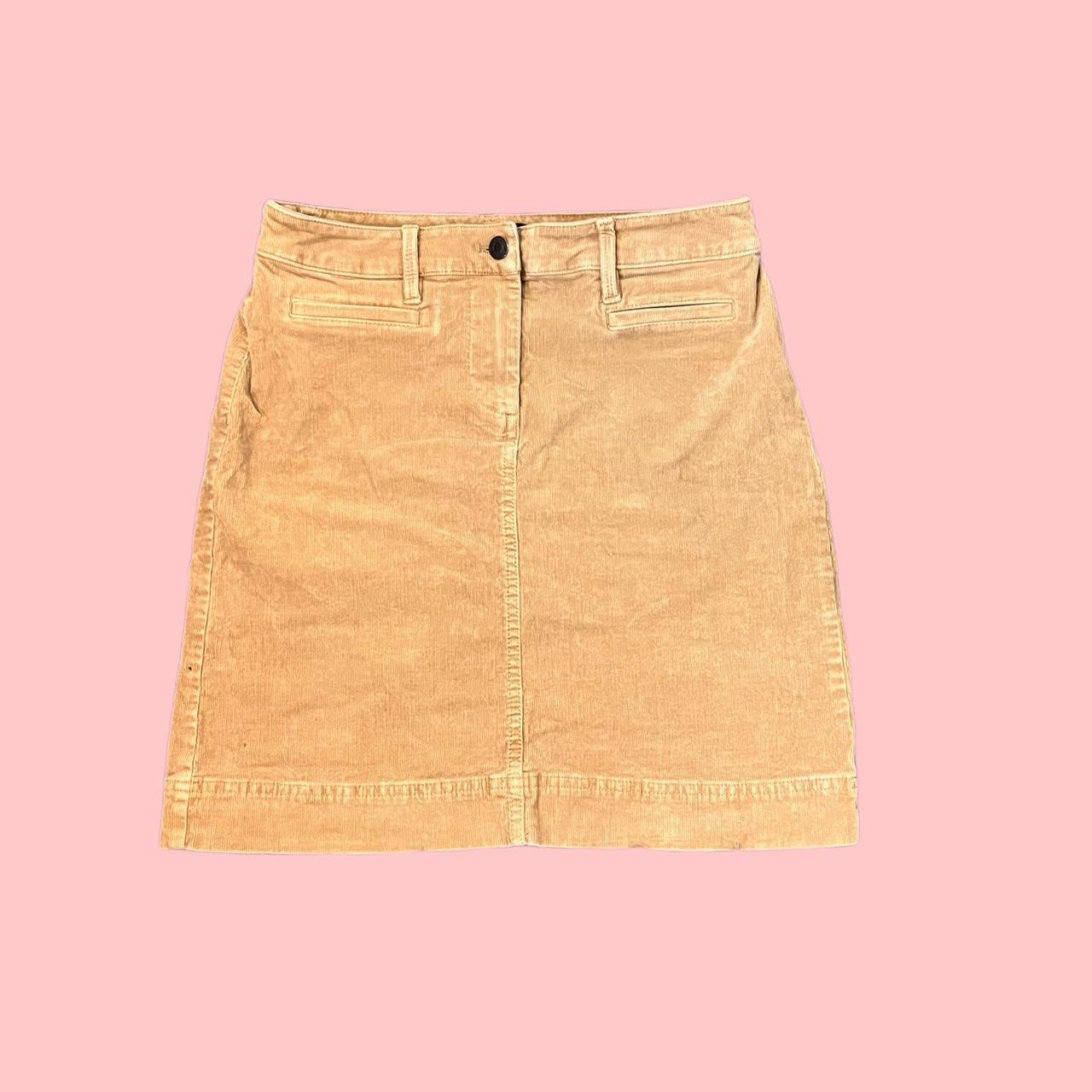 Tan colored midi skirt w pockets Size 2p Length... Depop