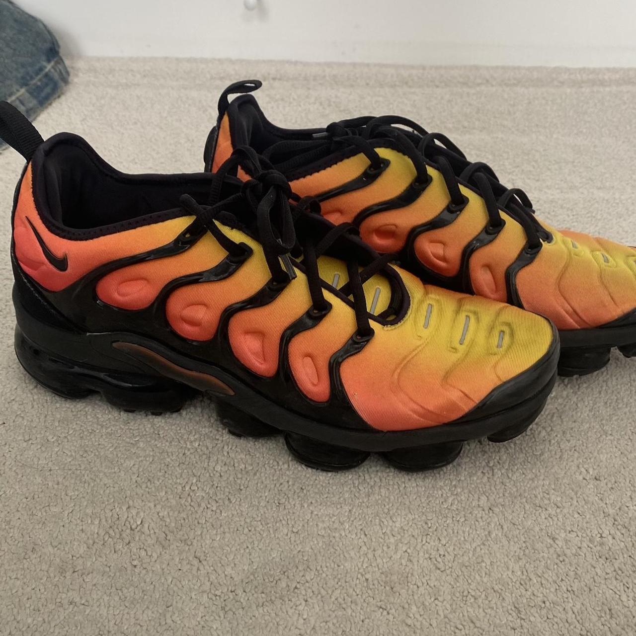 Black and orange nike vapormax plus hotsell