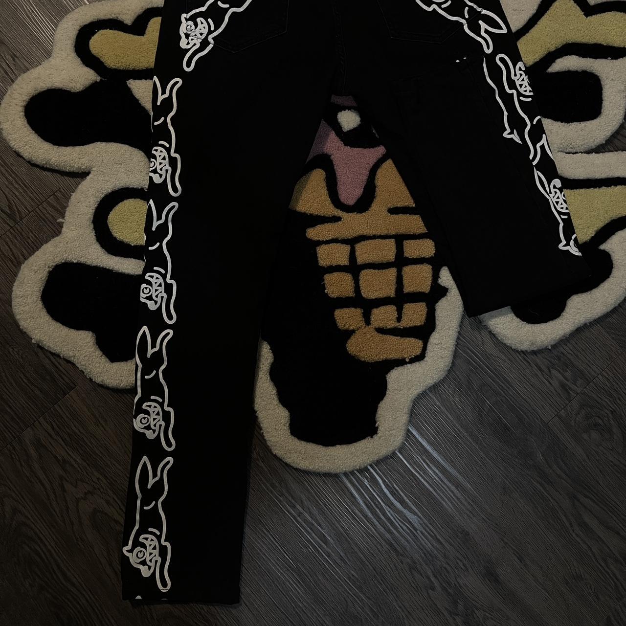 Black ice cream jeans with white painted running... Depop