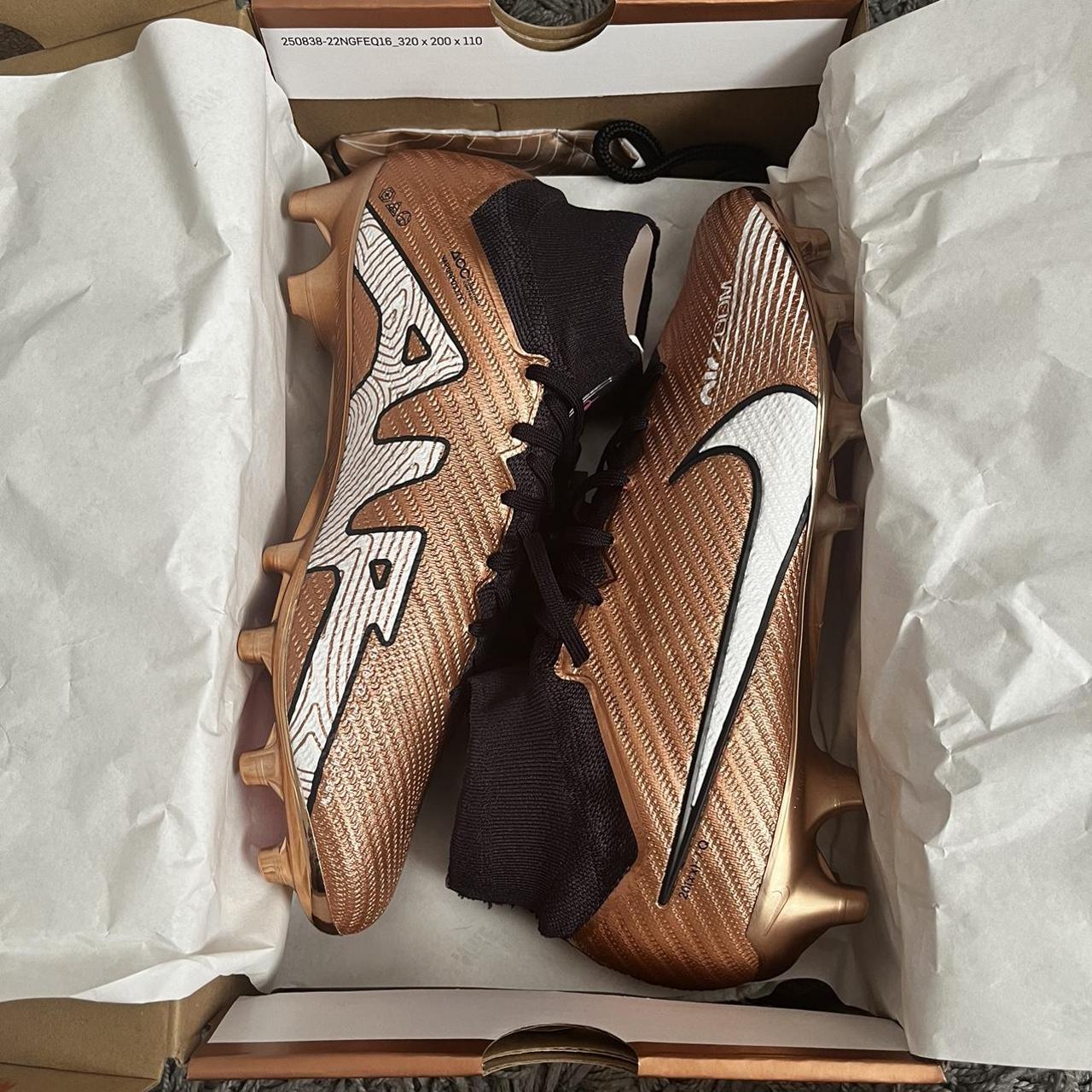 nike gold and black boots