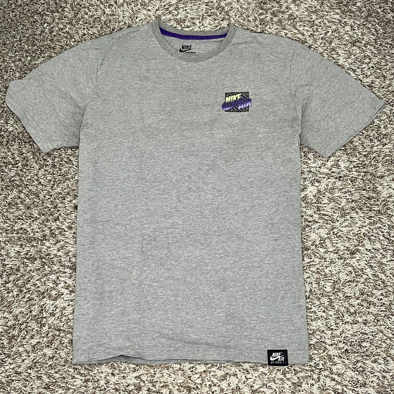 green and gray nike shirt
