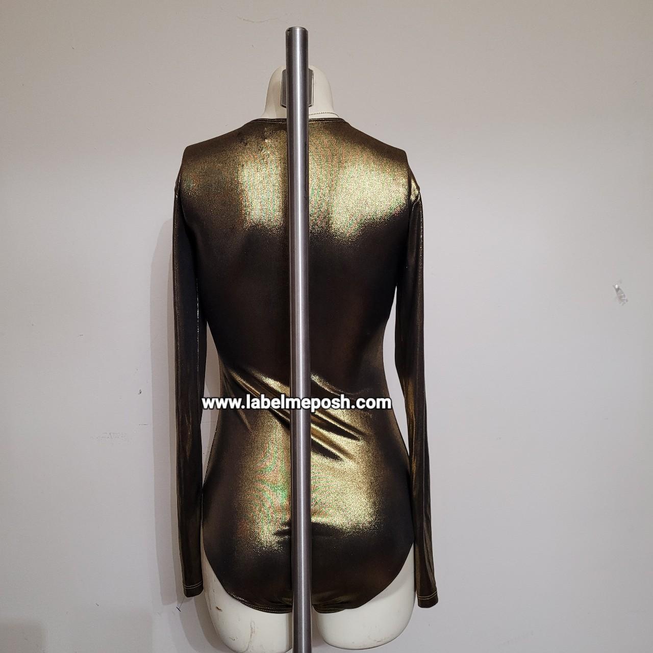 This is metallic bodysuit in the color gold. Very... Depop