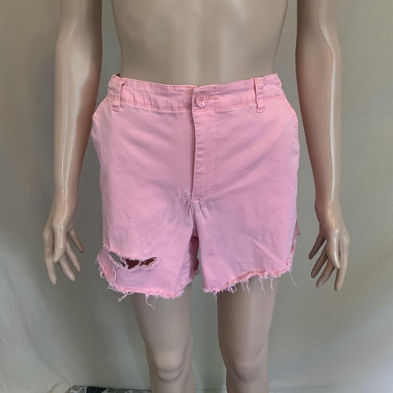 Ripped pink jean shorts brand is Bandolino. Good