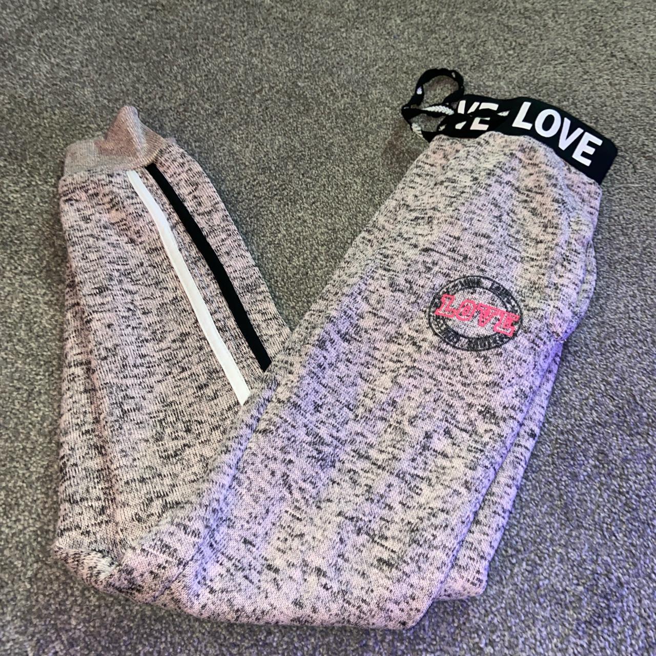 Pink love sweatpants joggers • size - Depop