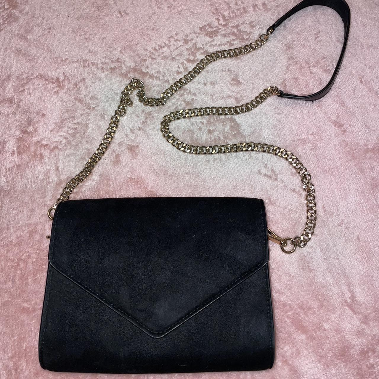 Used black and gold purse