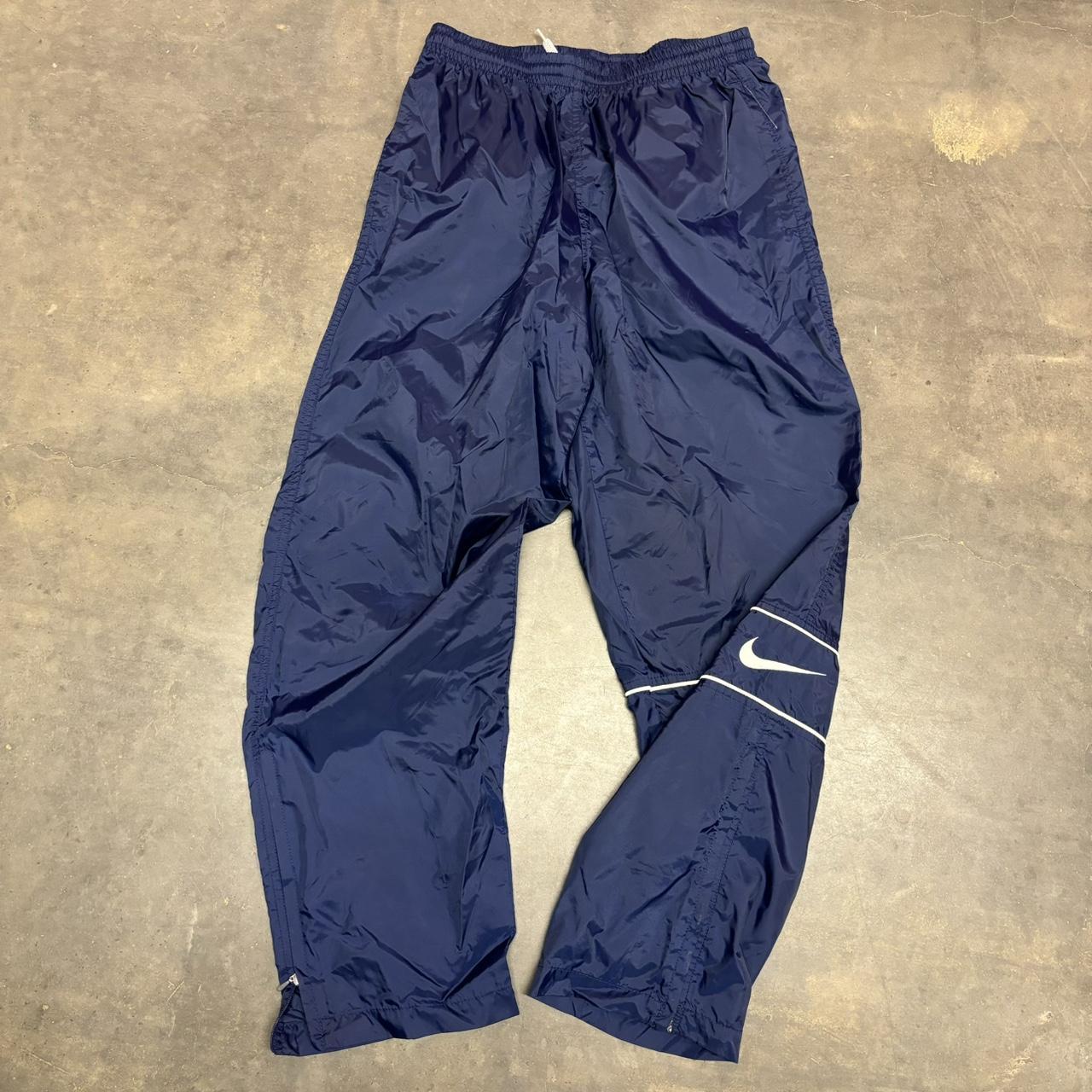 Dope pair of 90s Nike wind pants with crazy leg hit. Depop