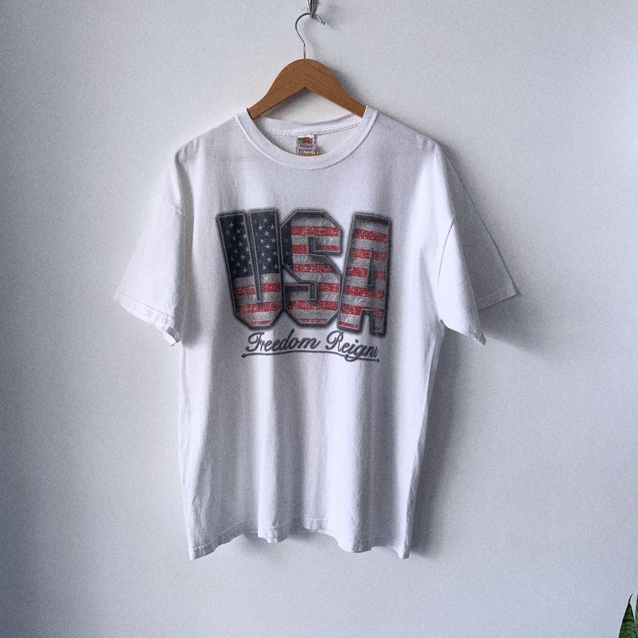 USA graphic tshirt. Print reads “Freedom Reigns”.... - Depop