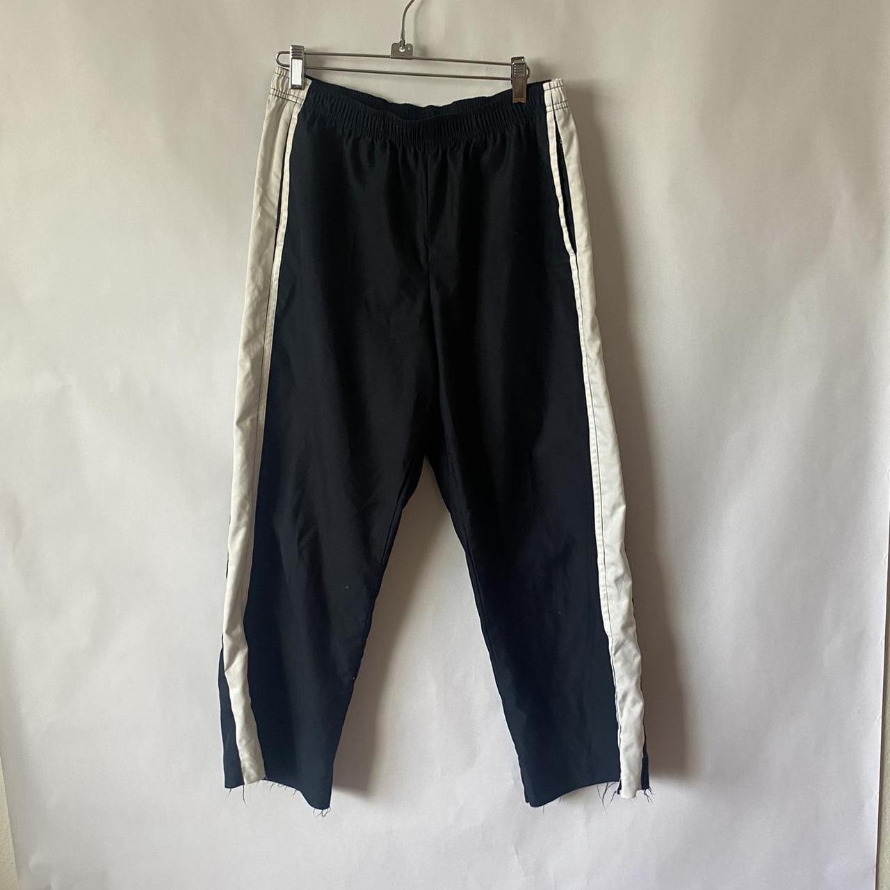 Nike track best sale pants with stripe