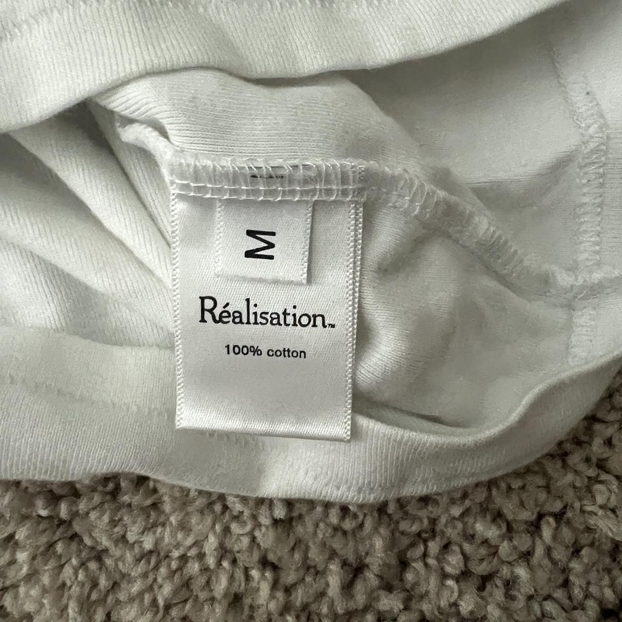 Realization Par Zodiac baby tee, barley worn, good... Depop