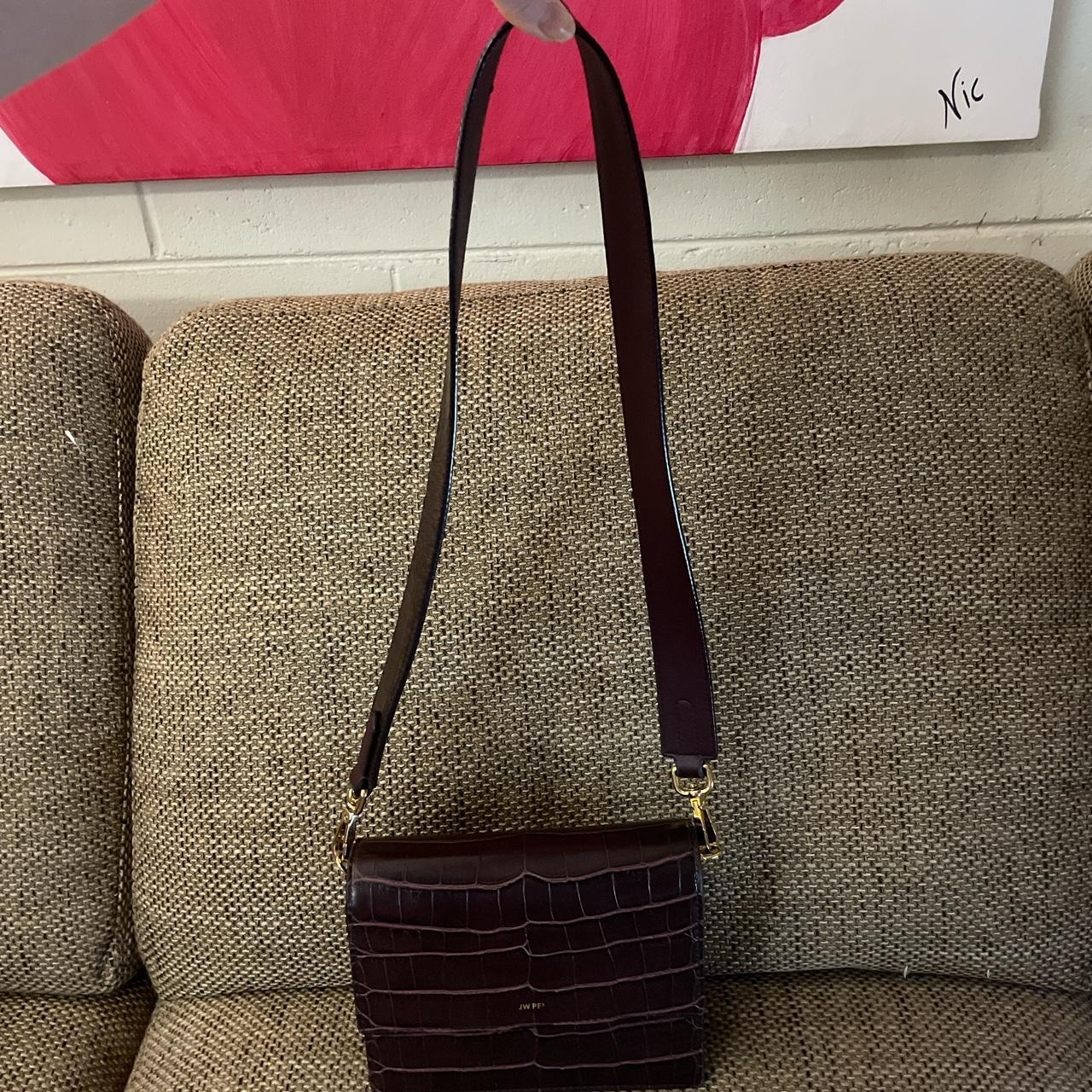 The JW PEI Mini Flap Crossbody is dressed in | Depop
