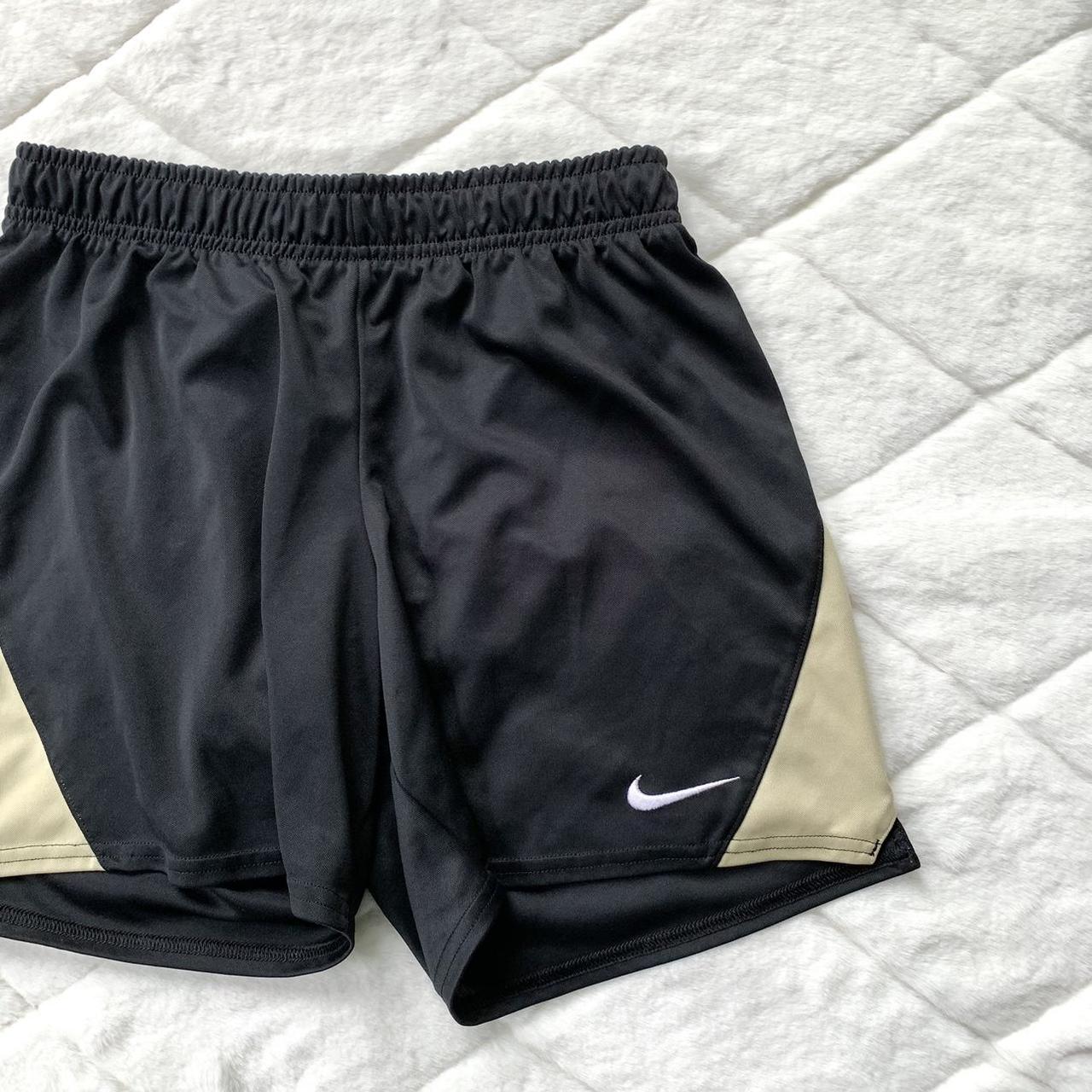 Black and best sale gold nike shorts