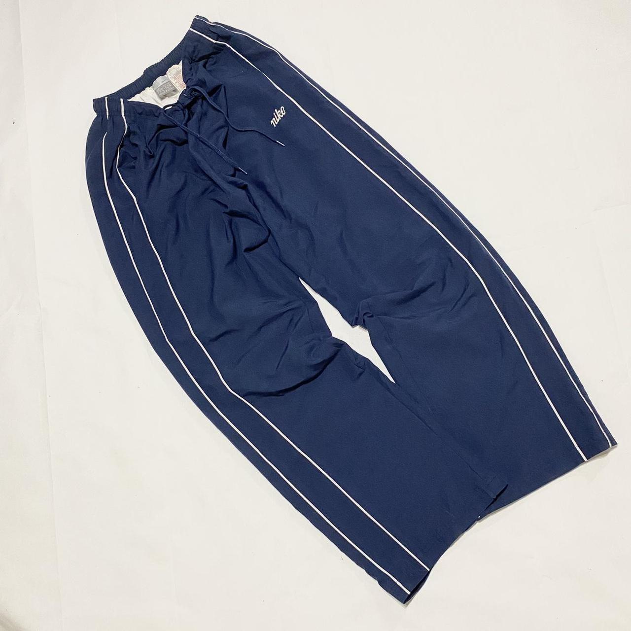 Vintage navy Nike tracksuit bottoms / track pants... - Depop