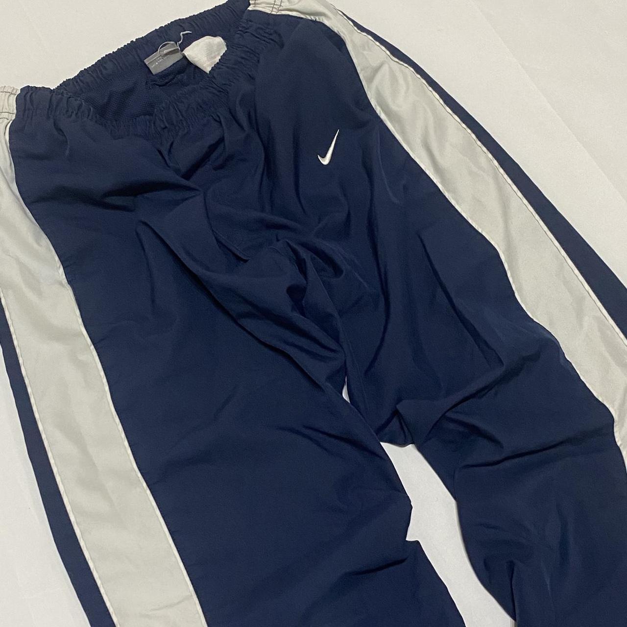 Vintage navy Nike tracksuit bottoms / track pants... Depop