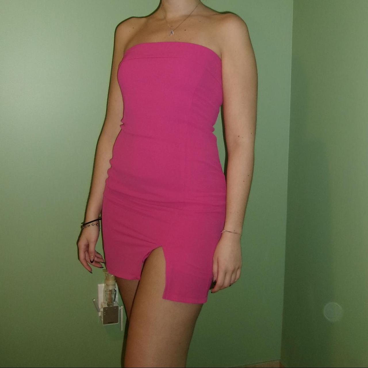 Bright pink strapless mini dress with slit. Folded... - Depop