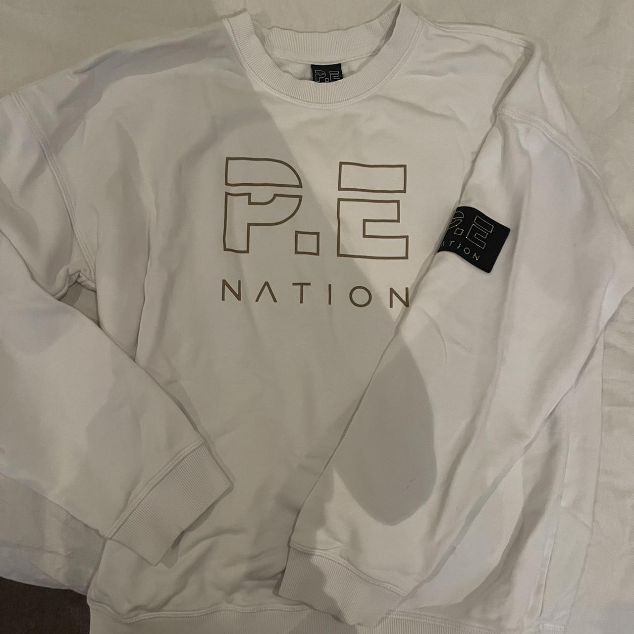 PE Nation white with gold writing sweater Size - Depop