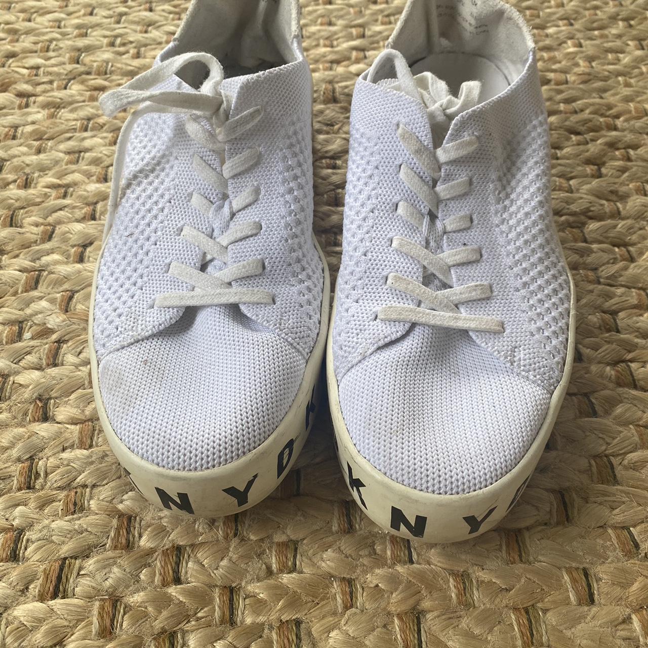 White DKNY sneakers with lace up fastening shaped. Depop