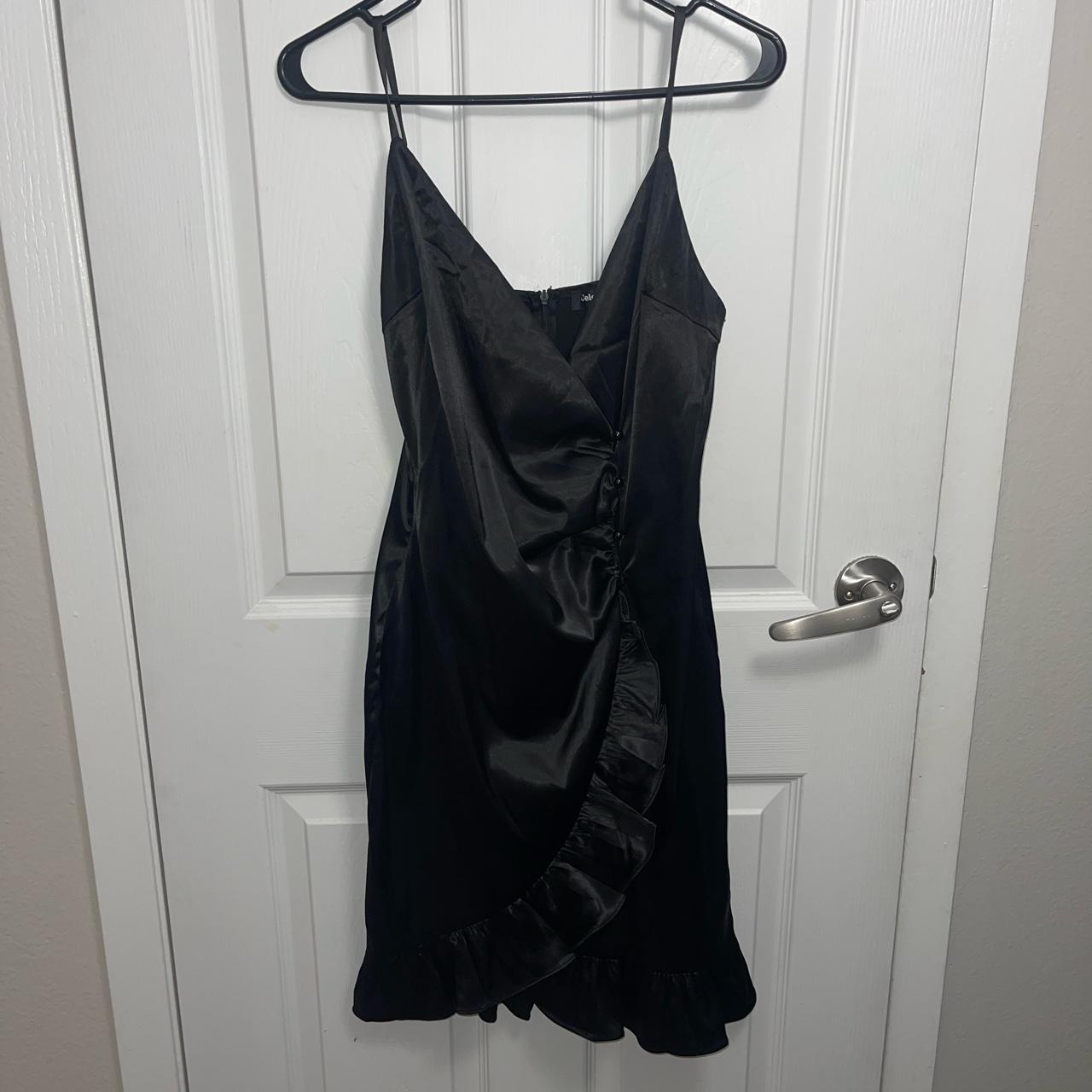 A satin black wrap over dress with side button... - Depop