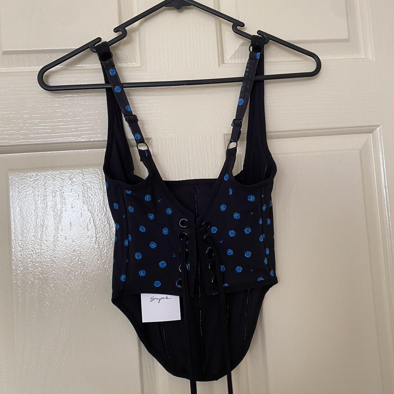 Supre black and blue floral corset top. Size... Depop