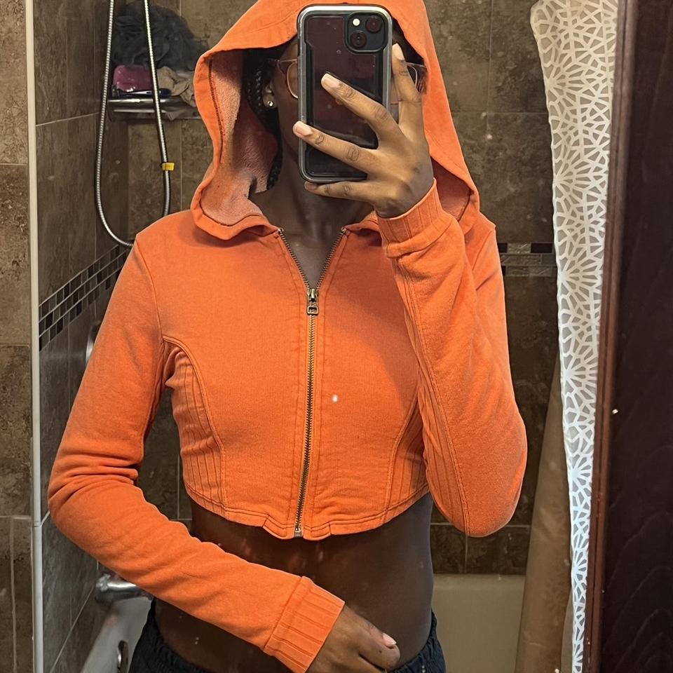 Orange zip up online top