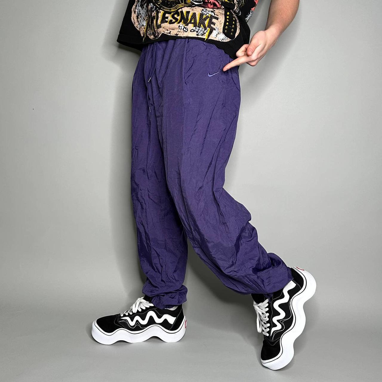 Purple and cheap black track pants