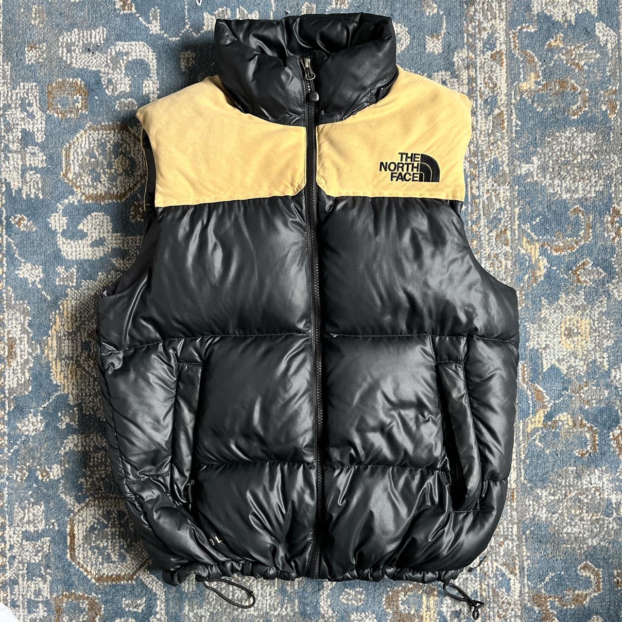 Black and gold deals north face vest