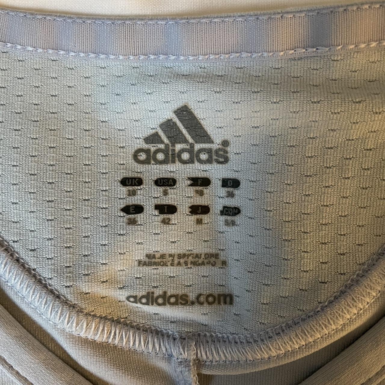 super cute baby blue adidas top size 8/10 stretchy... Depop