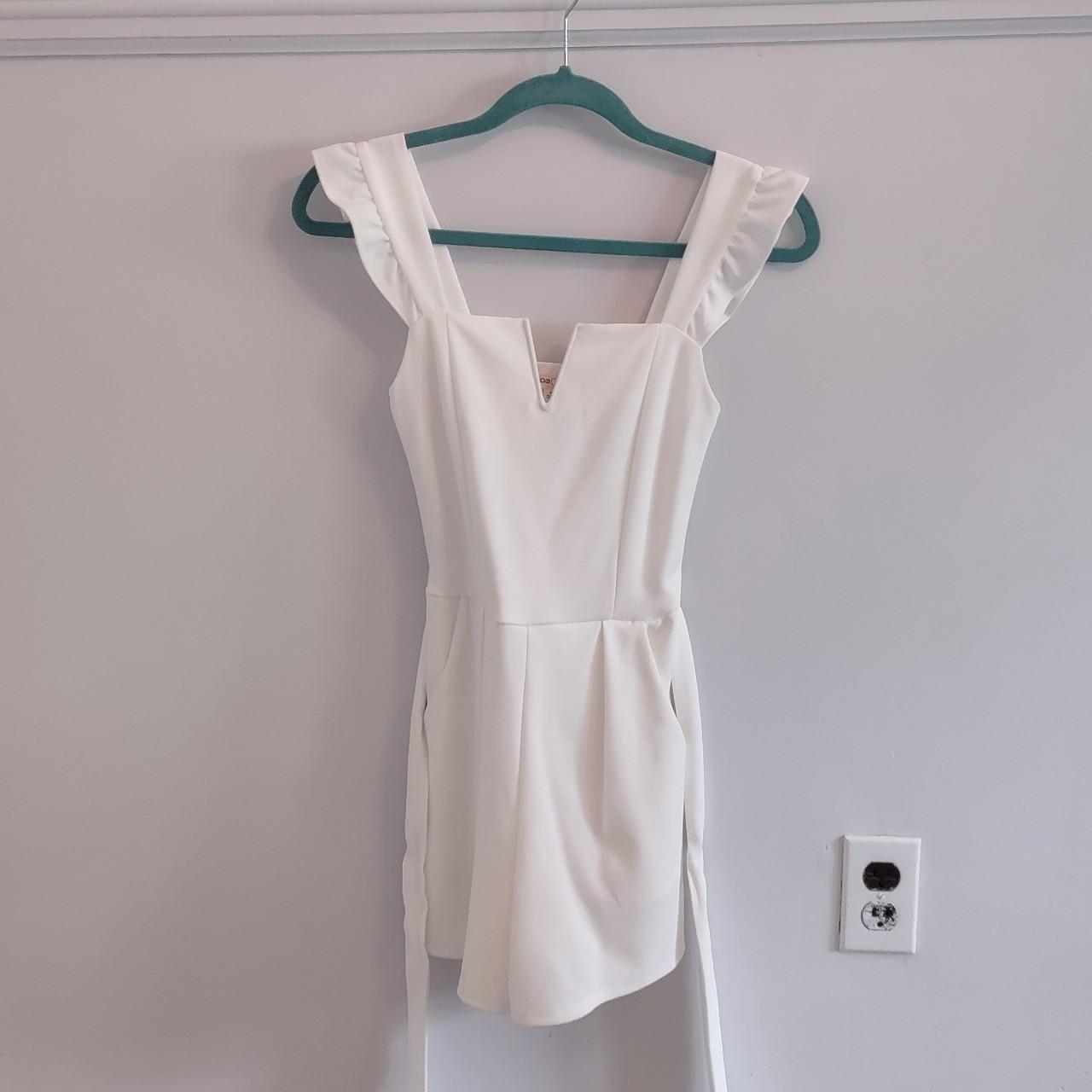 Super cute and flattering white romper. Swipe to see... Depop