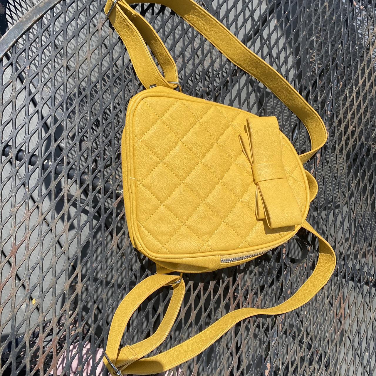 Betsy Johnson yellow quilted backpack bag with a bow. Depop