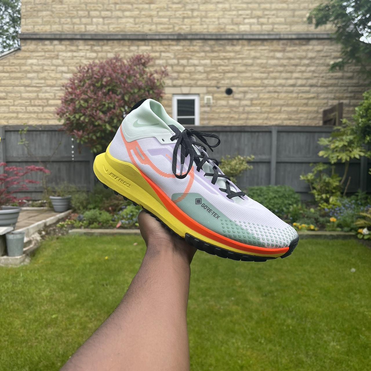 multi colour nike trainers