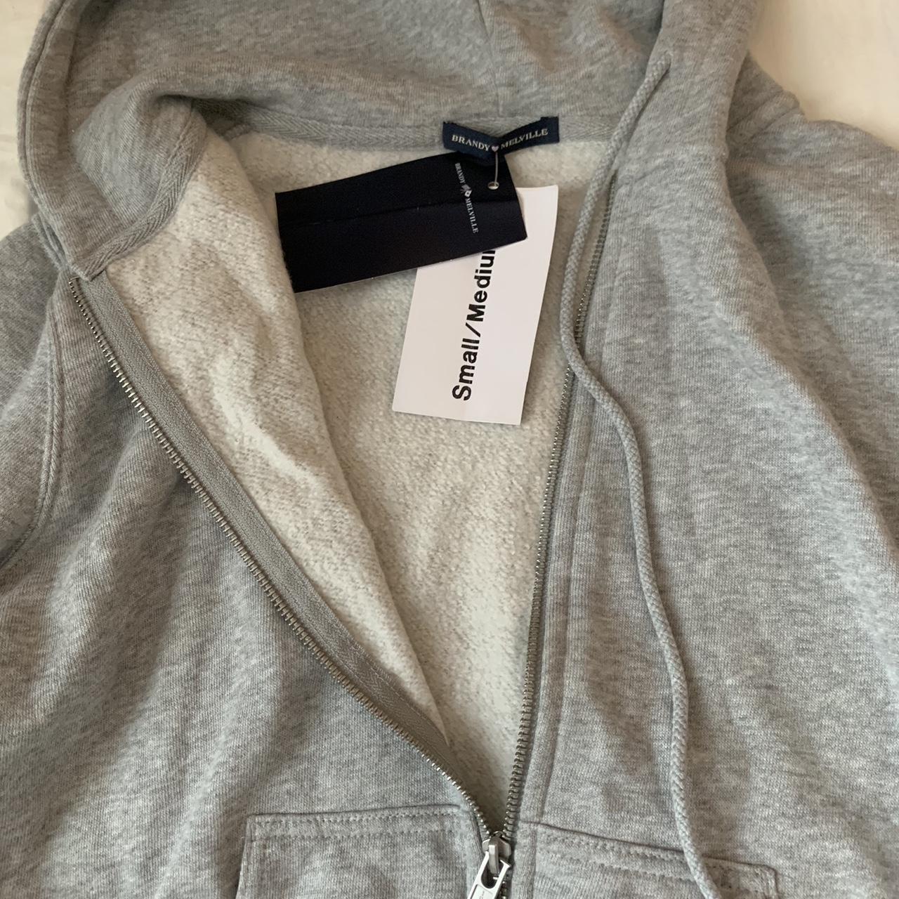 Brandy Melville grey zip up, brand new with tags,... Depop